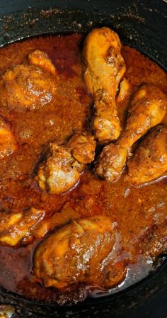 A close-up of delicious gravy chicken curry served in a bowl."